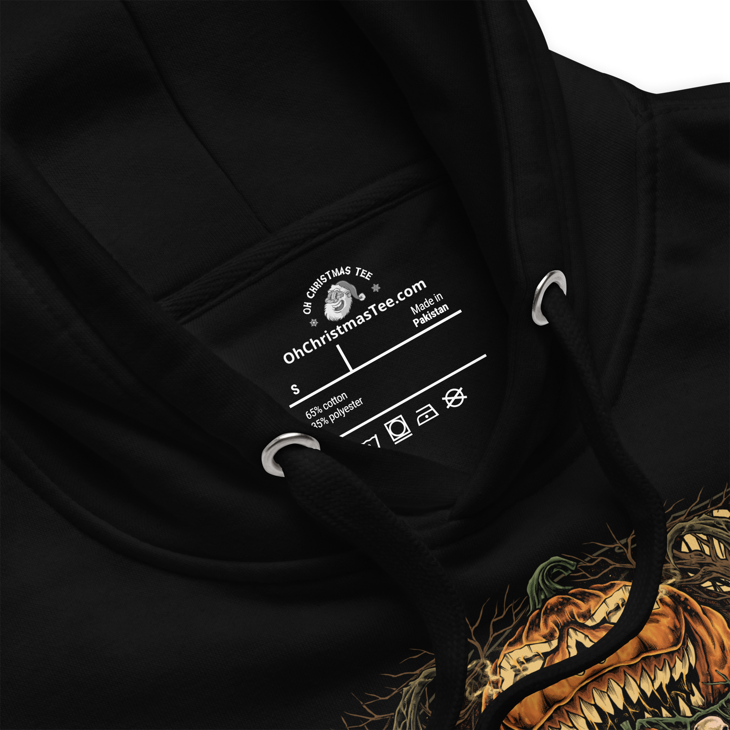 Black hoodie close up showing the tag of the halloween themed sweater.