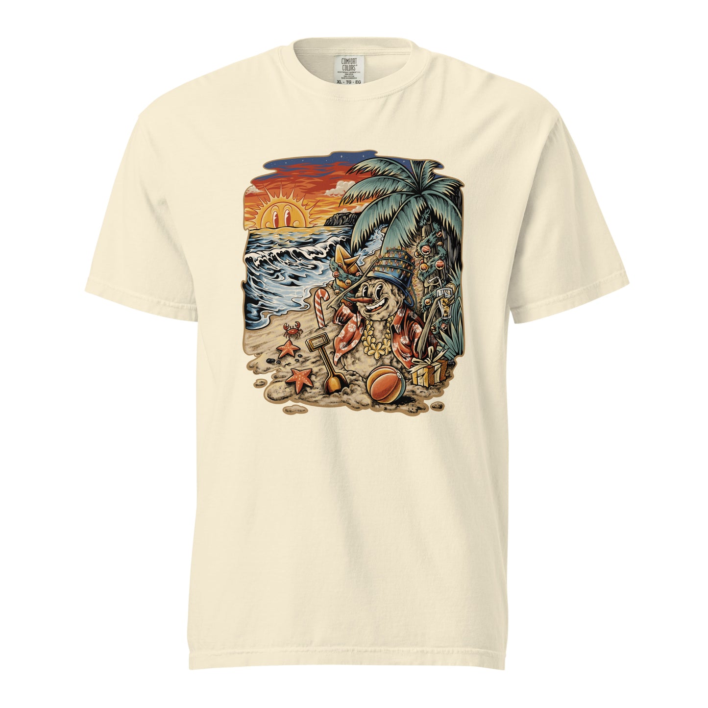 Cream colored T‑shirt displaying Frosty the Sandman reclining on a tropical beach, complete with a palm tree, starfish, a beach ball, and an orange sunset.
